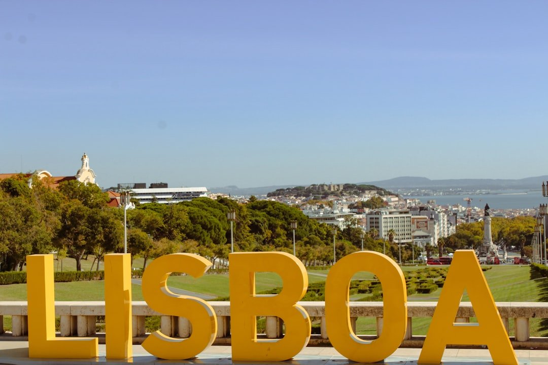 Large yellow lisboa letters with city view
